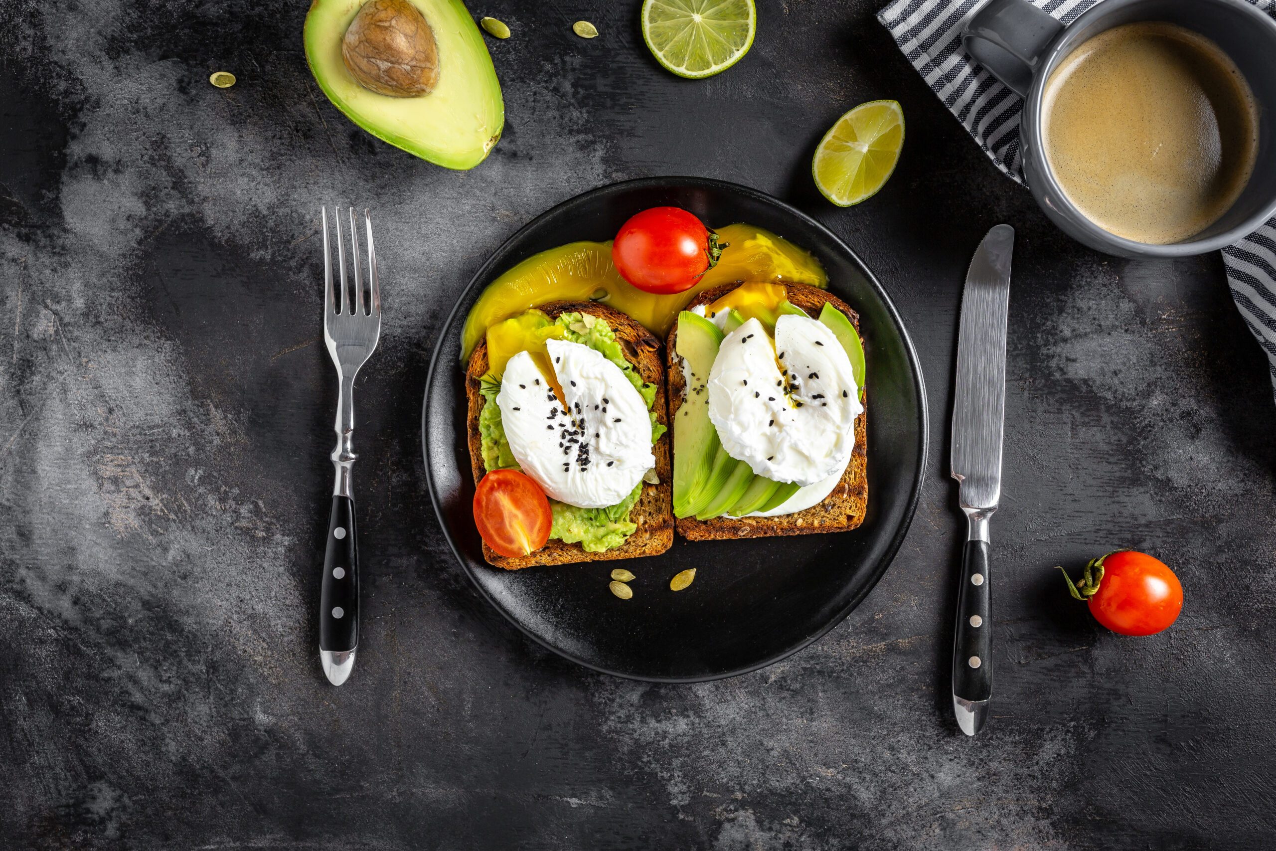 Healthy avocado toasts for breakfast or lunch with rye bread, sliced avocado, arugula, pumpkin and sesame seeds, salt and pepper. Vegetarian sandwiches. Plant based diet. Whole food concept